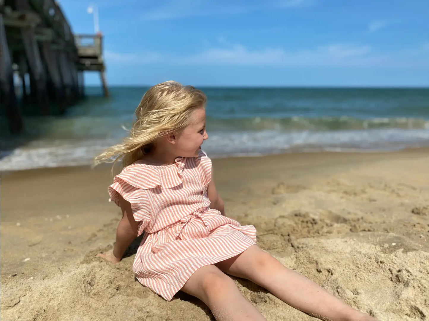 sandy romper in peach stripe