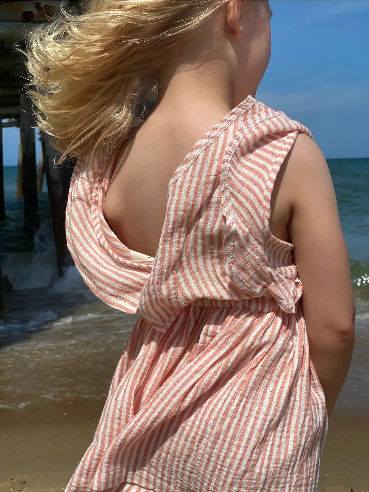 sandy romper in peach stripe